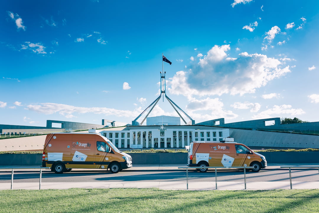 Orange Sky vans on the road in Canberra.